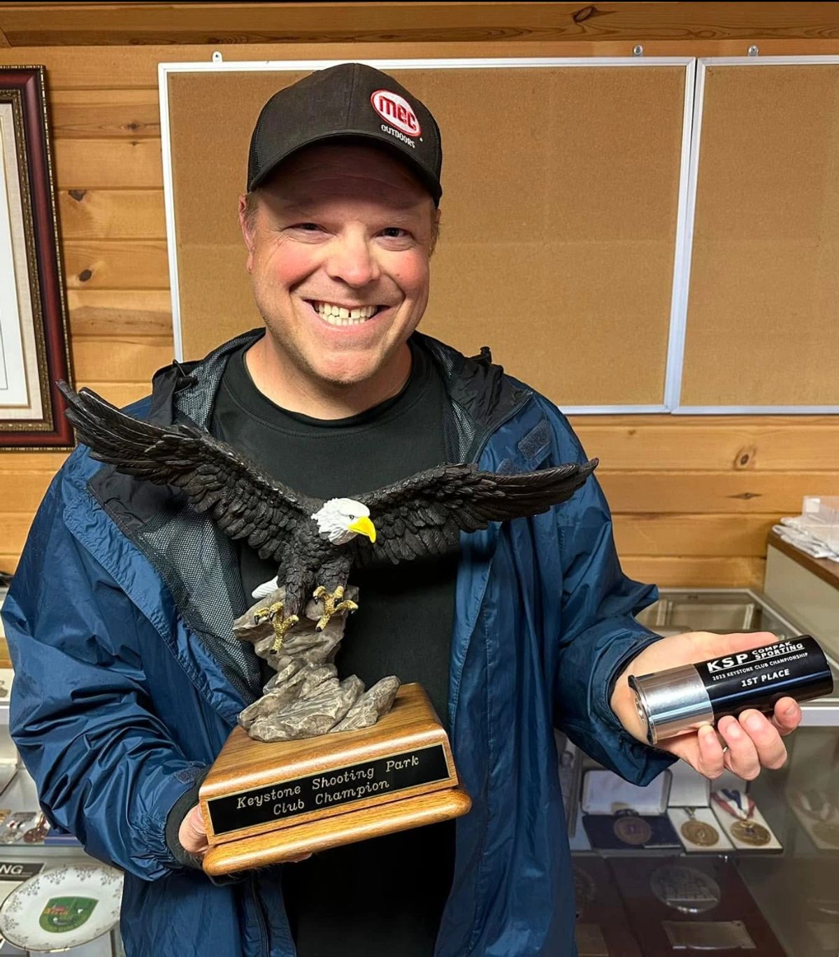 Jared Rumer holding Keystone Shooting Park Club Champion awards